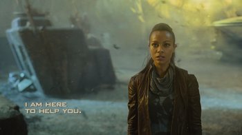 Movie still from “Star Trek Into Darkness” (2013), directed by J.J. Abrams – A woman standing in front of a wall; Medium shot, Over the shoulder angle