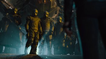 Movie still from “Star Trek Into Darkness” (2013), directed by J.J. Abrams – A group of people dressed in yellow armor; Wide shot, Low angle