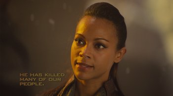 Movie still from “Star Trek Into Darkness” (2013), directed by J.J. Abrams – A woman that is looking into the distance; Close Up shot, Over the shoulder angle