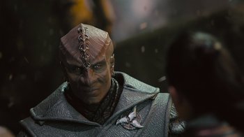Movie still from “Star Trek Into Darkness” (2013), directed by J.J. Abrams – A person wearing a costume; Close Up shot, Over the shoulder angle