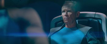 Movie still from “Star Trek Into Darkness” (2013), directed by J.J. Abrams – A man sitting in a chair looking into the distance; Close Up shot, Over the shoulder angle