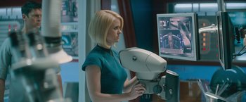 Movie still from “Star Trek Into Darkness” (2013), directed by J.J. Abrams – A woman in a blue shirt is looking at a monitor; Medium shot, Over the shoulder angle