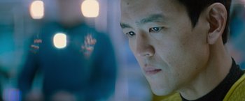 Movie still from “Star Trek Into Darkness” (2013), directed by J.J. Abrams – A man's face in front of a blurry background; Close Up shot, Low angle