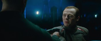 Movie still from “Star Trek Into Darkness” (2013), directed by J.J. Abrams – A man with a red beard is holding a gun; Close Up shot, Over the shoulder angle
