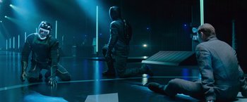 Movie still from “Star Trek Into Darkness” (2013), directed by J.J. Abrams – A man kneeling down on the ground in a dark room; Wide shot, High angle
