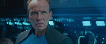 Movie still from “Star Trek Into Darkness” (2013), directed by J.J. Abrams – An older man in a blue shirt and jacket; Close Up shot, Over the shoulder angle