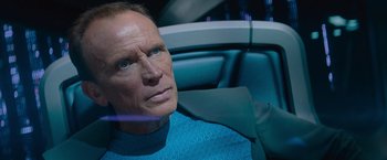 Movie still from “Star Trek Into Darkness” (2013), directed by J.J. Abrams – A person sitting in a car; Close Up shot, Over the shoulder angle