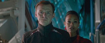 Movie still from “Star Trek Into Darkness” (2013), directed by J.J. Abrams – A man and a woman standing next to each other; Close Up shot, Over the shoulder angle