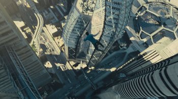 Movie still from “Star Trek Into Darkness” (2013), directed by J.J. Abrams – A man in a blue shirt is in the air above a city; Extreme Wide shot, Overhead angle
