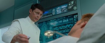 Movie still from “Star Trek Into Darkness” (2013), directed by J.J. Abrams – A man standing in front of a computer screen; Medium shot, Over the shoulder angle