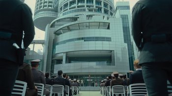 Movie still from “Star Trek Into Darkness” (2013), directed by J.J. Abrams – A group of people sitting on white chairs in front of a building; Extreme Wide shot, Low angle