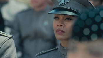 Movie still from “Star Trek Into Darkness” (2013), directed by J.J. Abrams – A woman in a uniform is looking at the camera; Close Up shot, Over the shoulder angle