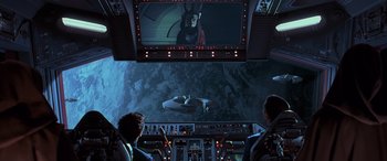 Movie still from “Star Wars: Episode I - The Phantom Menace” (1999), directed by George Lucas – Two people are looking at a screen in a plane; Extreme Wide shot, High angle
