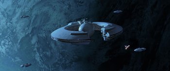 Movie still from “Star Wars: Episode I - The Phantom Menace” (1999), directed by George Lucas – An image of an alien ship in the sky; Extreme Wide shot, Low angle