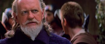 Movie still from “Star Wars: Episode I - The Phantom Menace” (1999), directed by George Lucas – An old man with a long beard and a man with long hair; Close Up shot, Over the shoulder angle