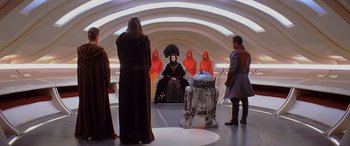 Movie still from “Star Wars: Episode I - The Phantom Menace” (1999), directed by George Lucas – A group of people standing in a room; Wide shot, High angle