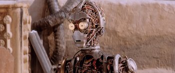 Movie still from “Star Wars: Episode I - The Phantom Menace” (1999), directed by George Lucas – The head of a robot with many wires; Close Up shot, Low angle