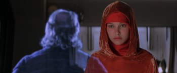 Movie still from “Star Wars: Episode I - The Phantom Menace” (1999), directed by George Lucas – A woman in a red robe and a man in a black robe; Close Up shot, Over the shoulder angle