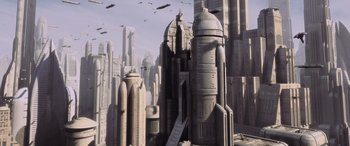 Movie still from “Star Wars: Episode I - The Phantom Menace” (1999), directed by George Lucas – An image of a city with a bunch of birds flying over it; Extreme Wide shot, High angle