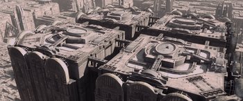 Movie still from “Star Wars: Episode I - The Phantom Menace” (1999), directed by George Lucas – An aerial view of a city with many buildings; Extreme Wide shot, High angle