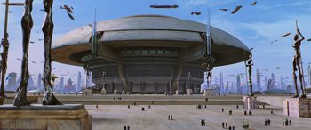 Movie still from “Star Wars: Episode I - The Phantom Menace” (1999), directed by George Lucas – An image of a large building in the middle of the day; Extreme Wide shot, Low angle