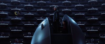 Movie still from “Star Wars: Episode I - The Phantom Menace” (1999), directed by George Lucas – A man and a woman standing in front of an audience; Extreme Wide shot, High angle