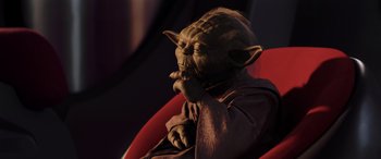 Movie still from “Star Wars: Episode I - The Phantom Menace” (1999), directed by George Lucas – A star wars character sitting in a chair; Close Up shot, High angle