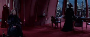 Movie still from “Star Wars: Episode I - The Phantom Menace” (1999), directed by George Lucas – A room that has a table and two chairs in it; Wide shot, High angle