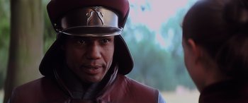 Movie still from “Star Wars: Episode I - The Phantom Menace” (1999), directed by George Lucas – A person wearing a hat; Close Up shot, Low angle