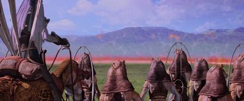 Movie still from “Star Wars: Episode I - The Phantom Menace” (1999), directed by George Lucas – A group of people standing on top of a grass covered field; Extreme Wide shot, Low angle