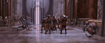 Movie still from “Star Wars: Episode I - The Phantom Menace” (1999), directed by George Lucas – A group of men in military garb standing in front of a building; Extreme Wide shot, High angle