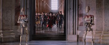 Movie still from “Star Wars: Episode I - The Phantom Menace” (1999), directed by George Lucas – A group of people walking down a hall way; Extreme Wide shot, High angle