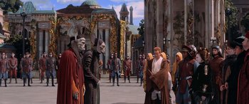 Movie still from “Star Wars: Episode I - The Phantom Menace” (1999), directed by George Lucas – A group of people dressed as star wars characters in front of a building; Extreme Wide shot, High angle