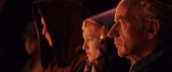 Movie still from “Star Wars: Episode I - The Phantom Menace” (1999), directed by George Lucas – A man and a woman sitting next to each other on a plane; Close Up shot, Over the shoulder angle
