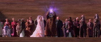 Movie still from “Star Wars: Episode I - The Phantom Menace” (1999), directed by George Lucas – A group of people standing on some steps; Wide shot, High angle