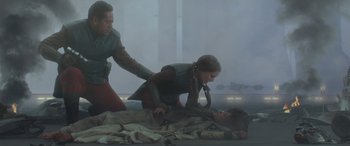 Movie still from “Star Wars: Episode II - Attack of the Clones” (2002), directed by George Lucas – A man and a woman are laying on the ground; Medium shot, Low angle