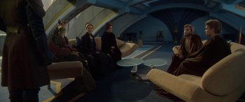 Movie still from “Star Wars: Episode II - Attack of the Clones” (2002), directed by George Lucas – A group of people sitting on couches in a room; Wide shot, High angle