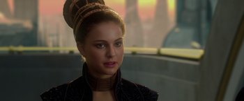 Movie still from “Star Wars: Episode II - Attack of the Clones” (2002), directed by George Lucas – A beautiful young lady wearing a black jacket; Close Up shot, Over the shoulder angle