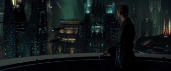 Movie still from “Star Wars: Episode II - Attack of the Clones” (2002), directed by George Lucas – A man standing in front of a large window; Wide shot, Over the shoulder angle