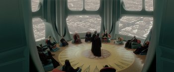 Movie still from “Star Wars: Episode II - Attack of the Clones” (2002), directed by George Lucas – A group of people sitting in front of a large window; Extreme Wide shot, High angle