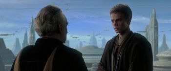 Movie still from “Star Wars: Episode II - Attack of the Clones” (2002), directed by George Lucas – Two men are standing in front of a sky background; Medium shot, Over the shoulder angle