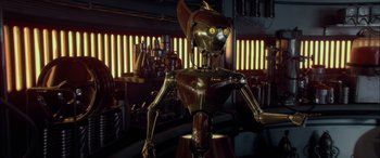 Movie still from “Star Wars: Episode II - Attack of the Clones” (2002), directed by George Lucas – An animated robot is standing in front of a bar; Medium shot, High angle