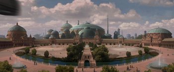 Movie still from “Star Wars: Episode II - Attack of the Clones” (2002), directed by George Lucas – An artistic rendering of an ancient city with domes and green domes; Extreme Wide shot, High angle