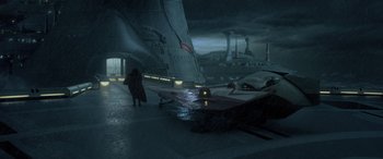 Movie still from “Star Wars: Episode II - Attack of the Clones” (2002), directed by George Lucas – A person standing in front of a ship in the dark; Extreme Wide shot, High angle