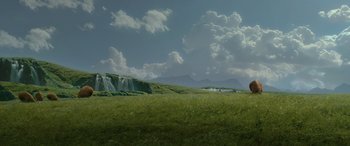 Movie still from “Star Wars: Episode II - Attack of the Clones” (2002), directed by George Lucas – A grassy field with a waterfall in the background; Extreme Wide shot, Low angle