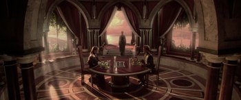 Movie still from “Star Wars: Episode II - Attack of the Clones” (2002), directed by George Lucas – Two people are sitting at a round table in front of a man; Extreme Wide shot, High angle