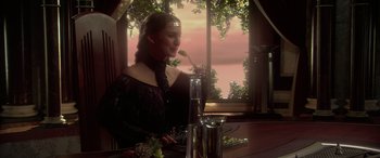 Movie still from “Star Wars: Episode II - Attack of the Clones” (2002), directed by George Lucas – A woman sitting at a table with a spoon in her mouth; Medium shot, Over the shoulder angle