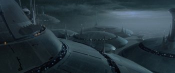 Movie still from “Star Wars: Episode II - Attack of the Clones” (2002), directed by George Lucas – An aerial view of a city in the dark; Extreme Wide shot, High angle