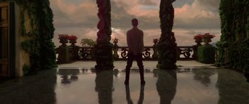 Movie still from “Star Wars: Episode II - Attack of the Clones” (2002), directed by George Lucas – A man standing in front of a sky background; Extreme Wide shot, Low angle