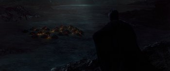 Movie still from “Star Wars: Episode II - Attack of the Clones” (2002), directed by George Lucas – A man standing in front of a pile of garbage; Extreme Wide shot, High angle